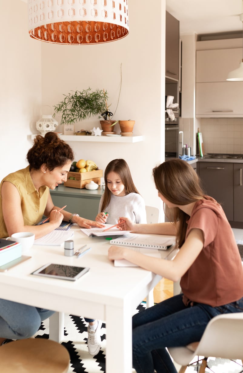 Mother Helping Her Children Study at Home